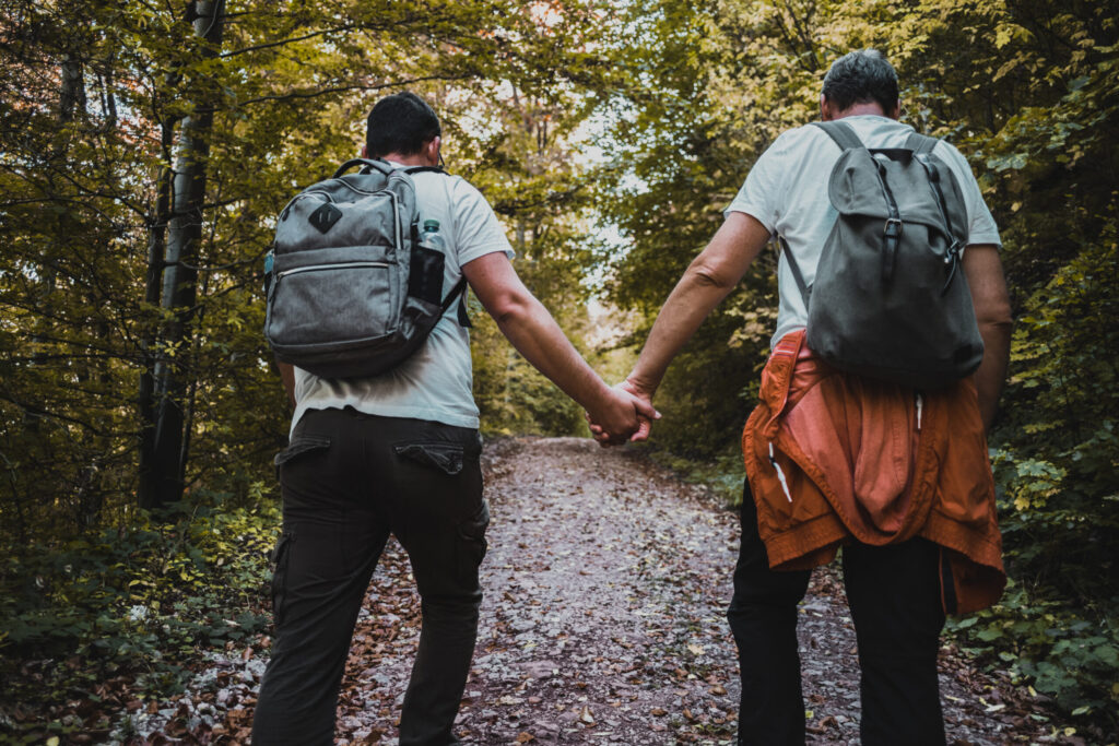 Couple holding hands while taking a walk